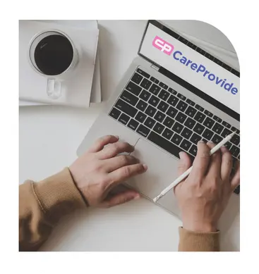 Person completing CareProvide home care request form on laptop