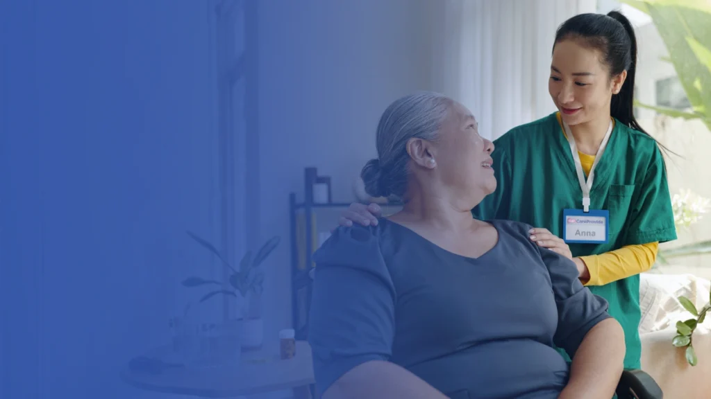 Caregiver supporting a woman at home with companionship and daily assistance during recovery